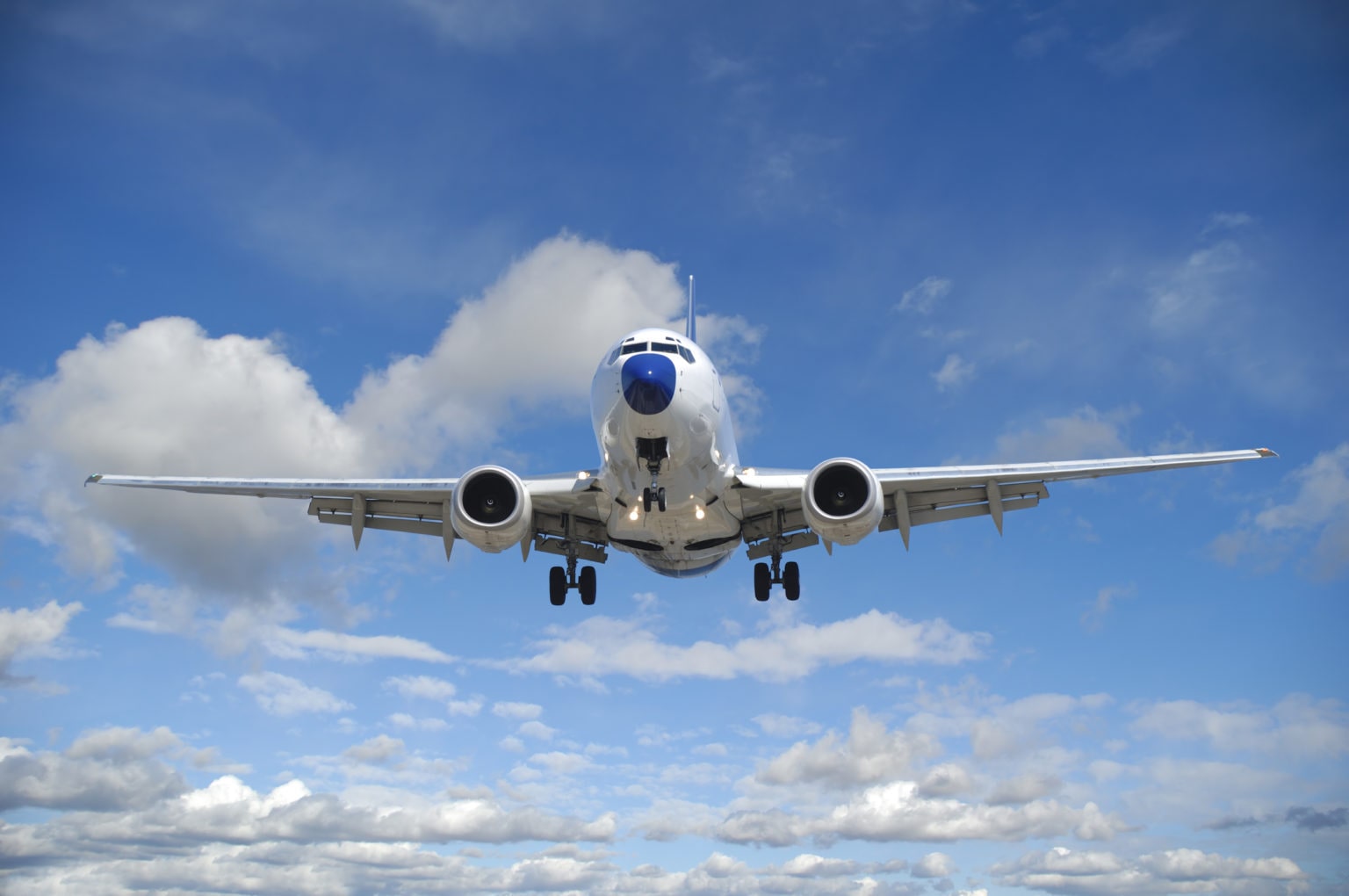 air-travel-plane-is-flying-in-blue-sky-with-clouds-international